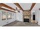 Bright living room with beamed ceilings and a cozy stone fireplace at 2344 Hollyridge Sw Dr, Marietta, GA 30060