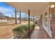 A covered front porch with tiled floor, wrought iron railing, and cozy street view at 2344 Hollyridge Sw Dr, Marietta, GA 30060