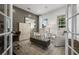 Elegant office space featuring French doors, a board and batten accent wall, and stylish furniture at 371 Foxglove Way, Mcdonough, GA 30253