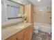 Full bathroom featuring a vanity, mirror, and shower-tub combination at 835 Glendale Ne Ter # 6, Atlanta, GA 30308