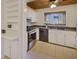 Charming kitchen with white cabinets, modern appliances, and a window overlooking the exterior at 835 Glendale Ne Ter # 6, Atlanta, GA 30308