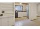 Bright kitchen with tiled floors, white cabinets, and modern stainless steel appliances at 835 Glendale Ne Ter # 6, Atlanta, GA 30308