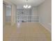 Open-concept room with tile flooring, a modern chandelier, and views of the upper level at 835 Glendale Ne Ter # 6, Atlanta, GA 30308