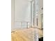 View of the living room with wood floors, soaring ceilings, and bright windows with exterior views at 835 Glendale Ne Ter # 6, Atlanta, GA 30308
