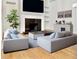 Inviting living room with a fireplace, shelving, neutral sofas, and modern decor at 835 Glendale Ne Ter # 6, Atlanta, GA 30308