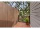 Private patio with fencing and a small garden, creating a cozy outdoor space at 835 Glendale Ne Ter # 6, Atlanta, GA 30308