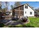 Backyard with a screened porch, outdoor seating around a fire pit, and lush green grass at 1309 Arnold Ne Ave, Atlanta, GA 30324