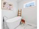 Bright bathroom with a soaking tub, ladder accent, and modern fixtures at 1309 Arnold Ne Ave, Atlanta, GA 30324