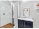 Sleek bathroom with glass-enclosed shower, wood floor, modern fixtures, and vessel sink at 1309 Arnold Ne Ave, Atlanta, GA 30324