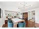 Dining room with hardwood floors, a modern chandelier, and seating for six at 1309 Arnold Ne Ave, Atlanta, GA 30324