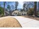 Charming home with a covered front porch, landscaped yard, and curved driveway at 1309 Arnold Ne Ave, Atlanta, GA 30324