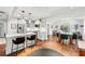 Open concept kitchen with stainless steel appliances, island seating, and an adjacent dining area at 1309 Arnold Ne Ave, Atlanta, GA 30324