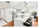 Bright kitchen featuring stainless steel appliances, a large island with seating, and hardwood floors at 1309 Arnold Ne Ave, Atlanta, GA 30324