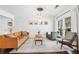 Bright living room with modern lighting, a patterned rug and a comfortable seating area at 1309 Arnold Ne Ave, Atlanta, GA 30324