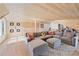 Spacious upper level living room with wood walls, plush sectional, and built-in shelving at 1309 Arnold Ne Ave, Atlanta, GA 30324