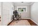 Bright office space featuring hardwood floors, a large window, and a modern desk at 1309 Arnold Ne Ave, Atlanta, GA 30324