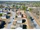 An aerial view of a neighborhood with houses, streets, trees, and a community pool at 1566 Wilson Manor Cir, Lawrenceville, GA 30045