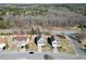 Aerial view showcasing the property's location and surrounding suburban neighborhood in a wooded area at 1566 Wilson Manor Cir, Lawrenceville, GA 30045