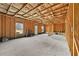 Unfinished basement with exposed wooden beams and framing, awaiting customization to your needs at 1566 Wilson Manor Cir, Lawrenceville, GA 30045