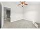 Bedroom with neutral walls, carpeting, and an open doorway at 1566 Wilson Manor Cir, Lawrenceville, GA 30045