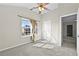 Bedroom with neutral walls, carpeting, and a window offering natural light at 1566 Wilson Manor Cir, Lawrenceville, GA 30045