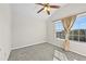 Bedroom with neutral carpet, a window, and natural light at 1566 Wilson Manor Cir, Lawrenceville, GA 30045