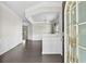 Welcoming entryway featuring hardwood floors, elegant trim, and a decorative glass front door at 1566 Wilson Manor Cir, Lawrenceville, GA 30045