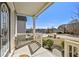 Inviting front porch offers a pleasant view of the neighborhood with white railings and ample sunlight at 1566 Wilson Manor Cir, Lawrenceville, GA 30045