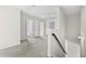Upstairs hallway with multiple doors, neutral paint, and plush carpet at 1566 Wilson Manor Cir, Lawrenceville, GA 30045