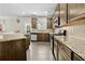 Well-appointed kitchen featuring granite countertops, stainless steel appliances, and stylish cabinetry at 1566 Wilson Manor Cir, Lawrenceville, GA 30045