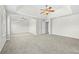 Spacious primary bedroom with vaulted ceiling, ceiling fans, plush carpet, and neutral paint at 1566 Wilson Manor Cir, Lawrenceville, GA 30045