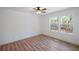 Bright bedroom featuring wood-look floors and a window with wooded views at 172 White Rose Ln, Temple, GA 30179