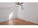 Bright bedroom with neutral walls, wood-look flooring and a ceiling fan at 172 White Rose Ln, Temple, GA 30179