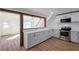 Open concept kitchen featuring stainless steel appliances and white cabinets at 172 White Rose Ln, Temple, GA 30179