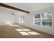 Bright and airy living room featuring a wooden support beam, hardwood floors, and lots of sunlight at 172 White Rose Ln, Temple, GA 30179