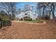 Large, private backyard with mature trees, offering a serene and secluded outdoor space at 3534 Brandywine Nw Rd, Kennesaw, GA 30144