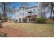 Expansive backyard with a stone patio and lush landscaping, ideal for relaxation and entertaining at 3534 Brandywine Nw Rd, Kennesaw, GA 30144