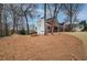 Spacious backyard with mature trees and a well-maintained lawn, offering plenty of room to enjoy at 3534 Brandywine Nw Rd, Kennesaw, GA 30144