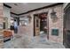 Basement entryway featuring stone floors, brick walls, and a rustic wooden door to the wine cellar at 3534 Brandywine Nw Rd, Kennesaw, GA 30144