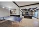 Finished basement area with a ping pong table and a comfortable seating area with built-in shelves at 3534 Brandywine Nw Rd, Kennesaw, GA 30144