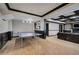 Finished basement with a ping pong table, coffered ceiling, and a cozy seating area at 3534 Brandywine Nw Rd, Kennesaw, GA 30144