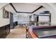 Basement view with a ping pong table, seating, and a bar area for entertaining at 3534 Brandywine Nw Rd, Kennesaw, GA 30144