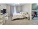 Minimalist bedroom with a cozy bed, modern shelving, and an open closet at 3534 Brandywine Nw Rd, Kennesaw, GA 30144
