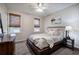 Cozy bedroom with natural light, a ceiling fan, and a bed with neutral-colored bedding at 3534 Brandywine Nw Rd, Kennesaw, GA 30144