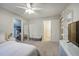 Bright bedroom with white furniture, a full-length mirror, and a view into the walk-in closet at 3534 Brandywine Nw Rd, Kennesaw, GA 30144
