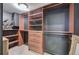 Walk-in closet with custom wood shelving and drawers for organization and storage at 3534 Brandywine Nw Rd, Kennesaw, GA 30144