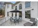 Spacious outdoor deck with dining table and chairs and lounge chair at 3534 Brandywine Nw Rd, Kennesaw, GA 30144