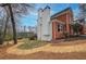 Beautiful brick home with white siding and mature trees at 3534 Brandywine Nw Rd, Kennesaw, GA 30144