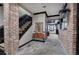 Grand foyer features stone floors, brick accents, and a staircase with wrought iron railings at 3534 Brandywine Nw Rd, Kennesaw, GA 30144