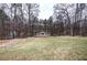 A gazebo surrounded by a lawn and trees provides an outdoor retreat at 3534 Brandywine Nw Rd, Kennesaw, GA 30144